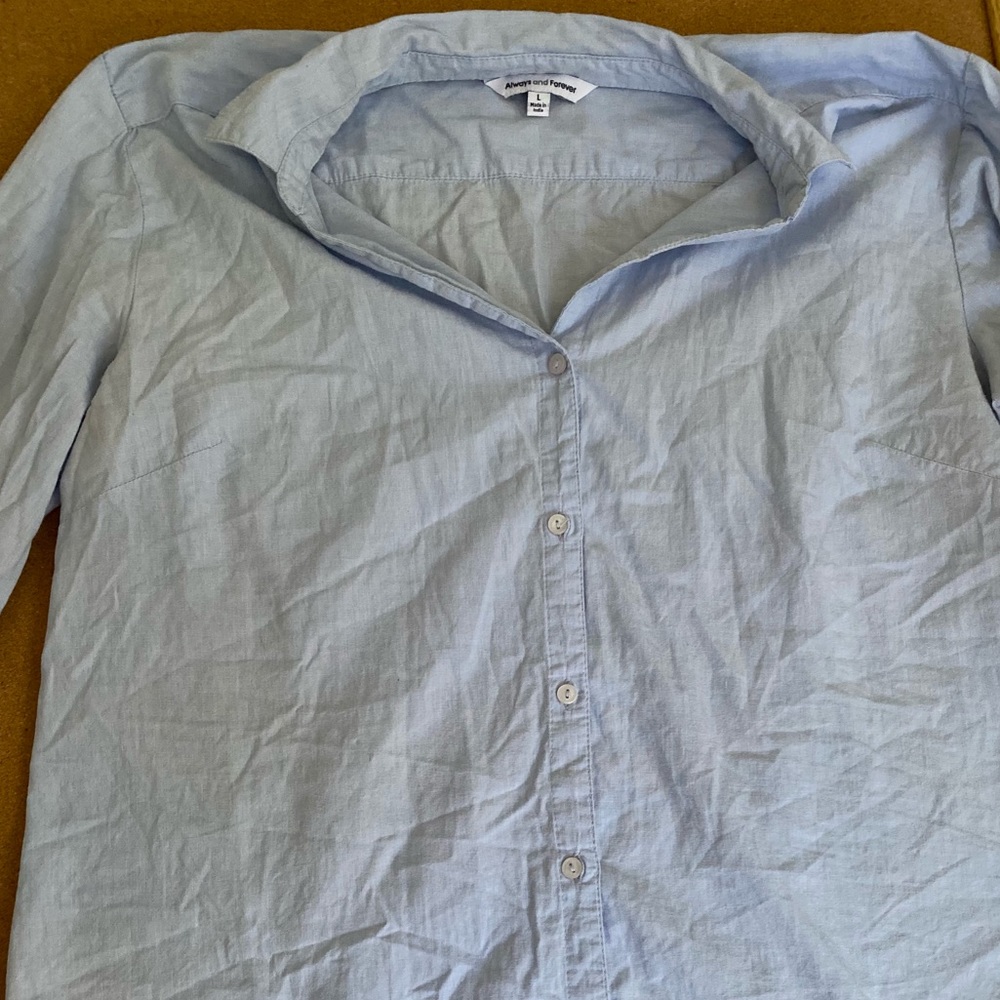 Light blue button down. Very light weight. Used condition.